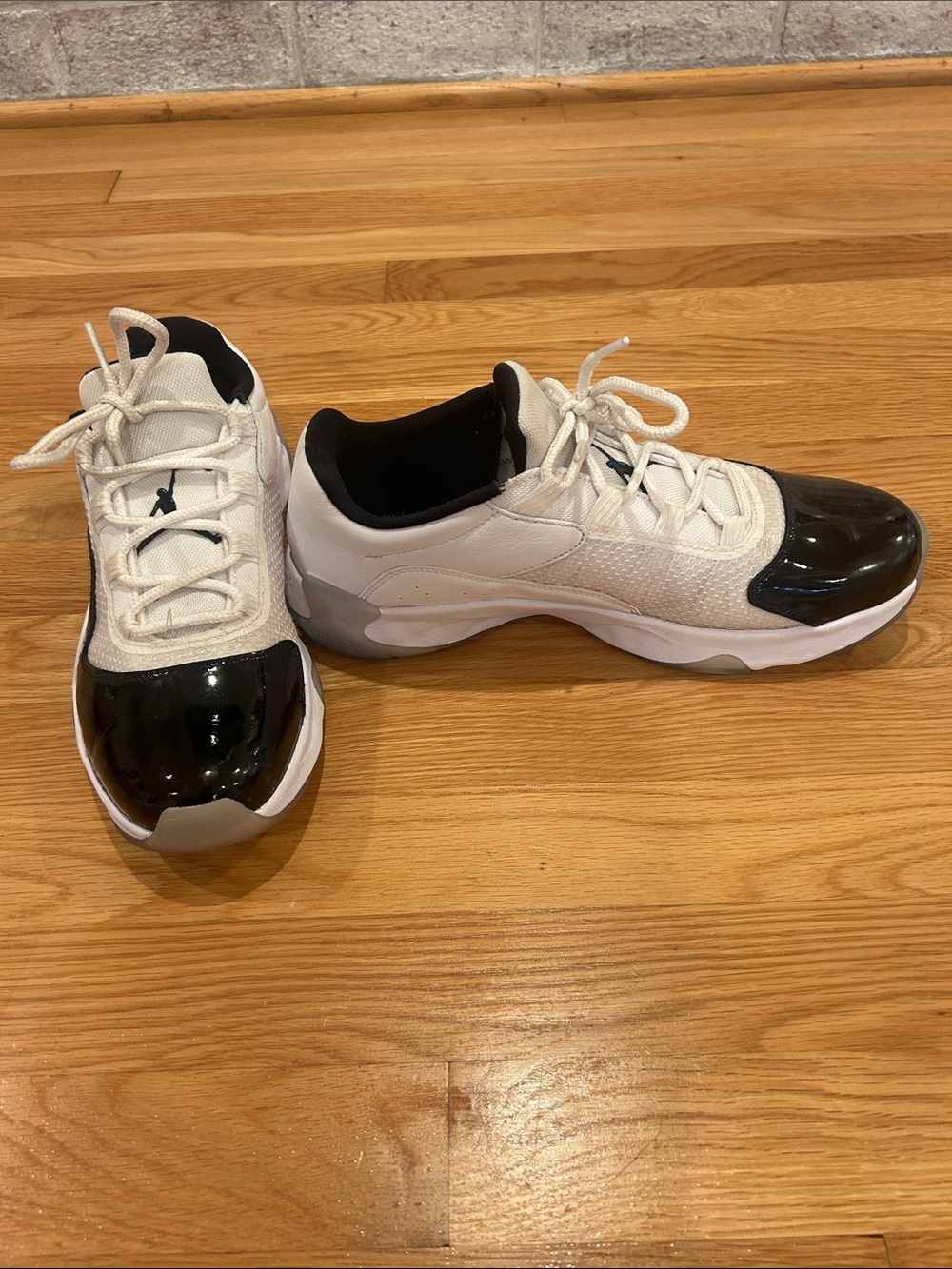 Air Jordan 11 CMFT Low-Top Sneakers in White and Black - men’s 10